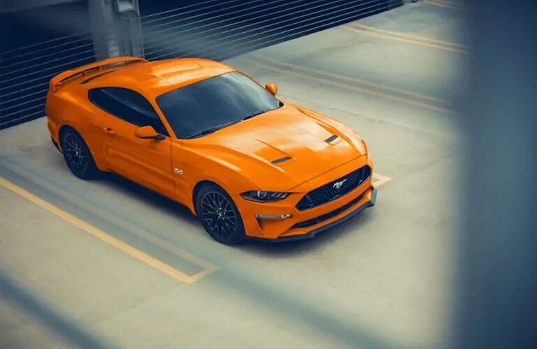Overhead view of orange 2020 Ford Mustang GT in parking lot