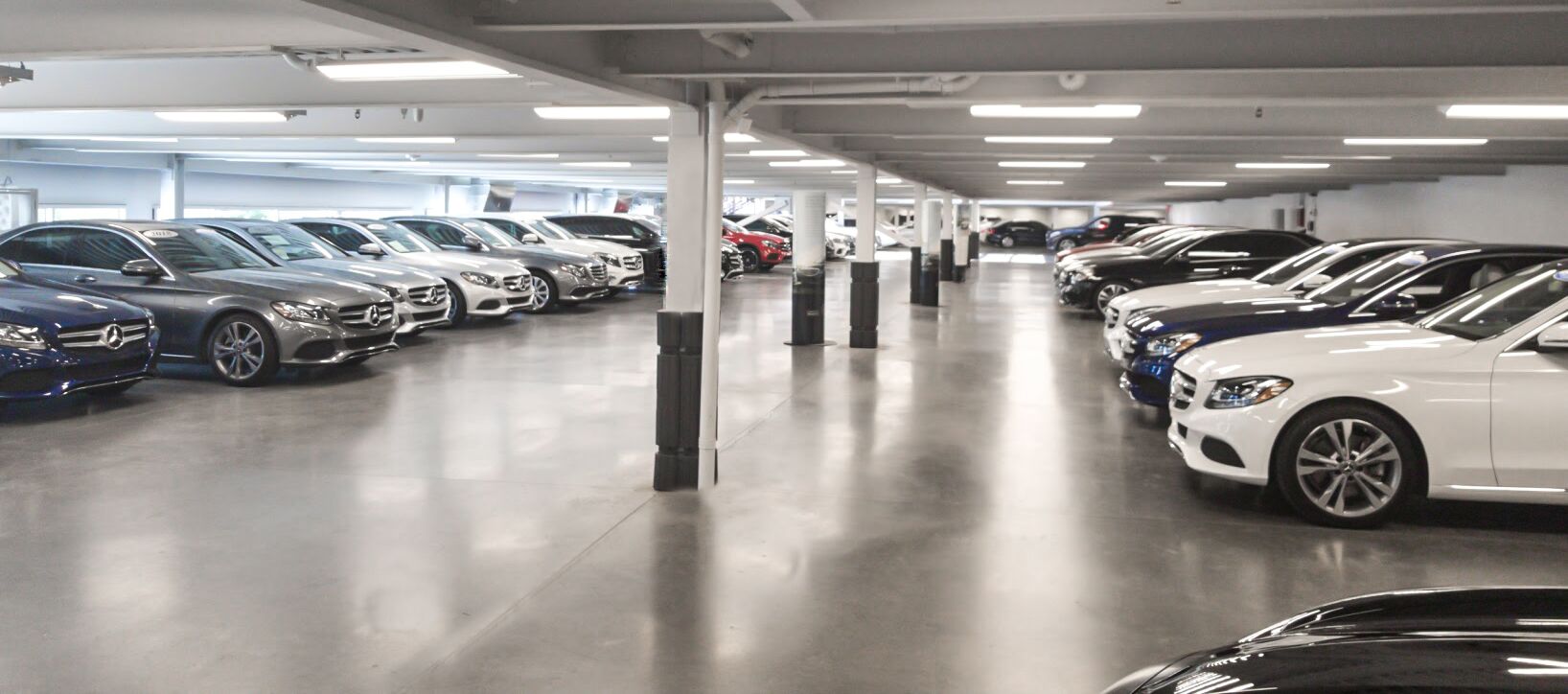 Cars lined up in dealership car lot