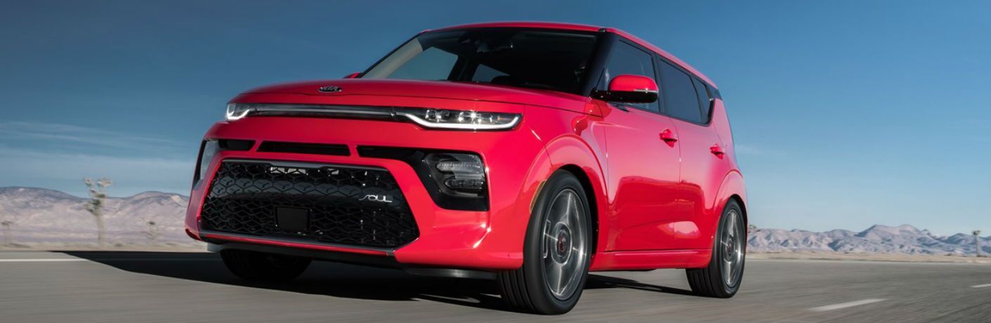 Red 2021 Kia Soul on a Desert Highway