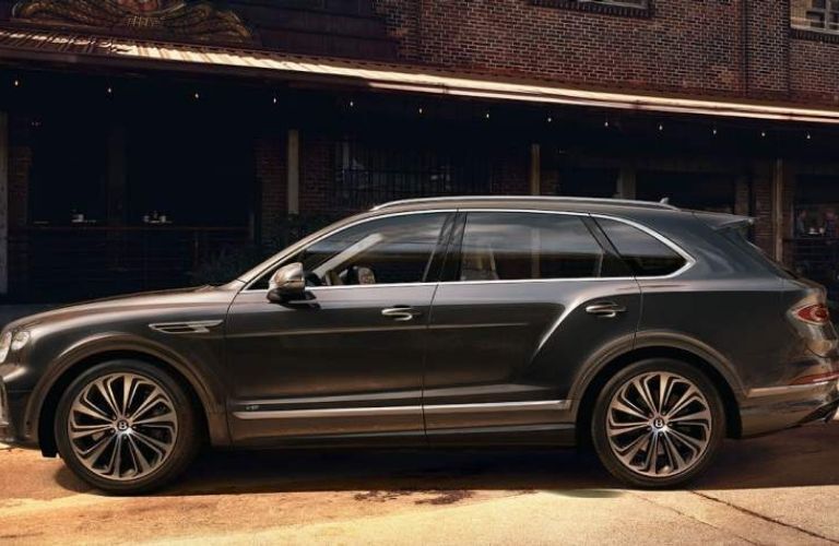 Bentley Bentyaga Activity Edition near a building