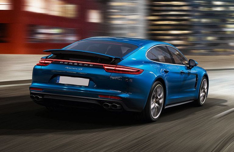 2017 Porsche Panamera driving past a city