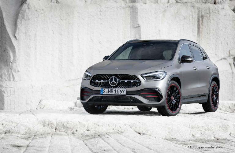 2021 MB GLA exterior front fascia drivers side on and in front of white stone wall