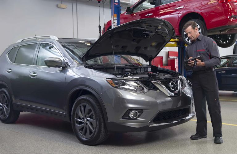 Mechanic inspecting a car's engine