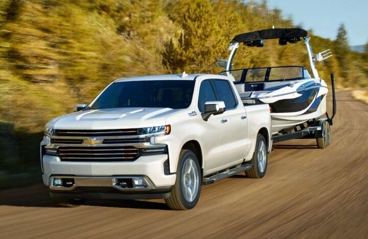 Used Chevy Silverado 1500 White towing a boat