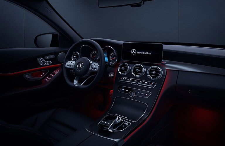 2020 MB C-Class interior front cabin steering wheel dashboard with red ambient lighting