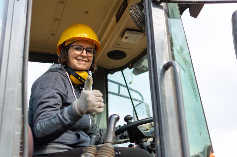 A woman being safe operating a heavy truck near Tampa.