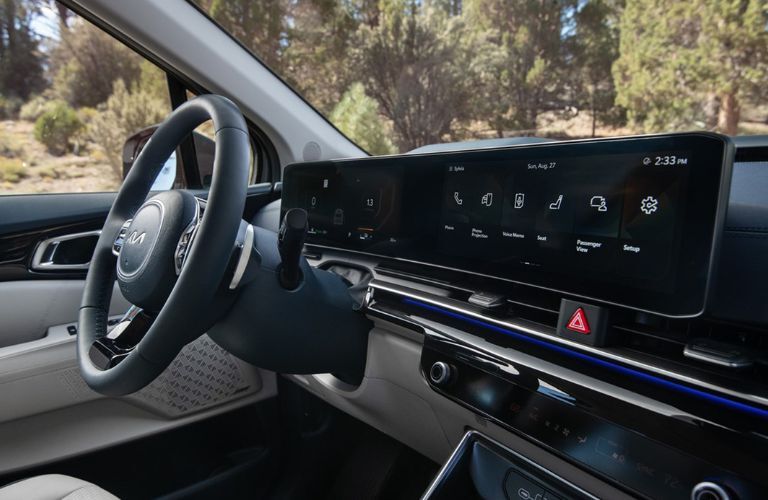 interior steering and dashboard of the 2025 Kia Carnival MPV