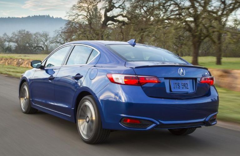 Rear three-quarter view of the 2016 Acura ILX driving