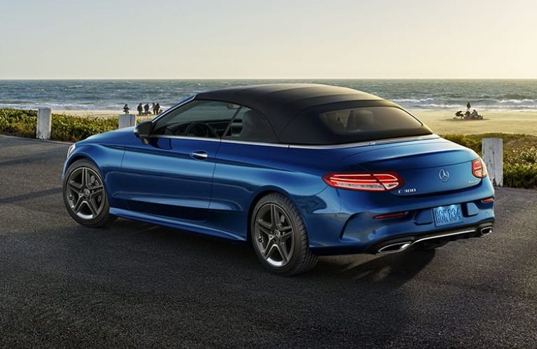 Rear three-quarter view of the 2023 Mercedes-Benz C-Class Cabriolet parked