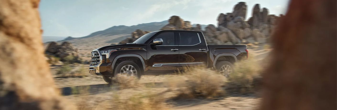 Side view of the 2023 Toyota Tundra i-FORCE MAX 1794 Edition off-road