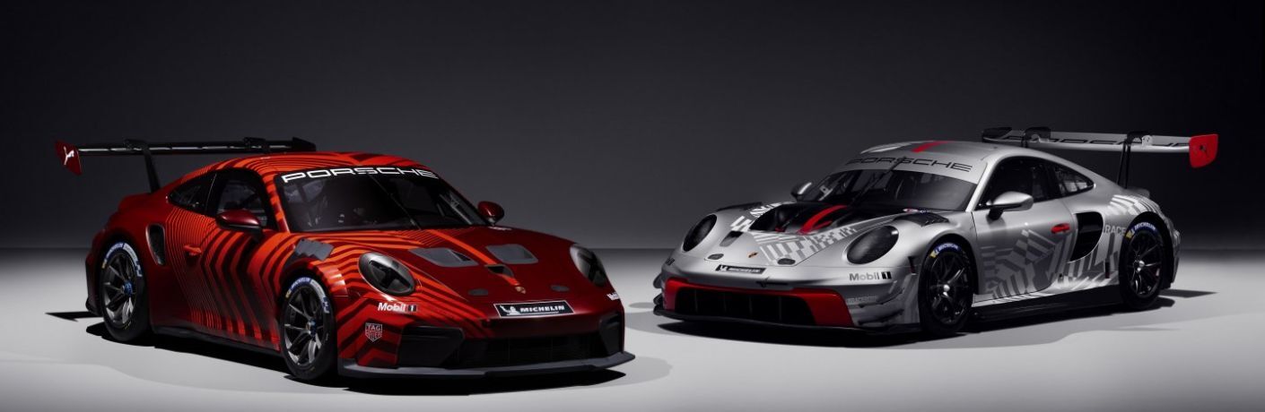 Two Porsche 911 Cup parked side by side