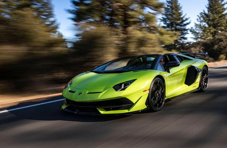 Pre-Owned Aventador SVJ Green driving on the road