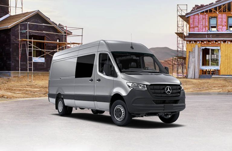 2026 Mercedes-Benz Sprinter Crew Van front and side angle at a work site