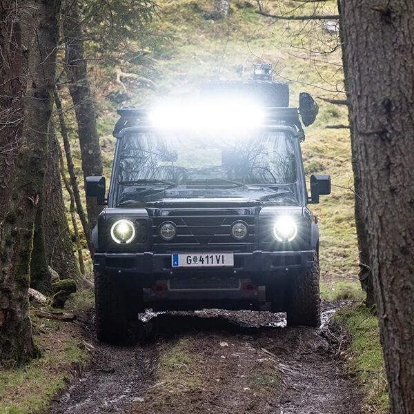 Head on shot of the 2025 INEOS Grenadier in forest.