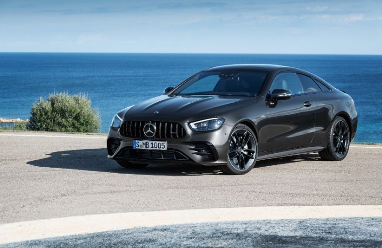 2021 MB E-Class exterior front fascia driver side in front of blue ocean