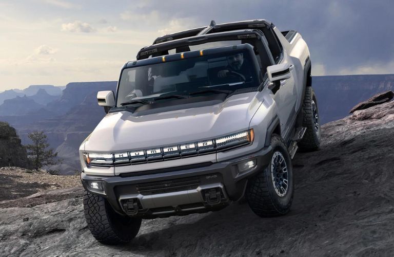 2023 GMC Hummer driving down hill