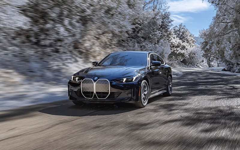 2025 BMW i4 eDrive40 driving in winter front driver's side