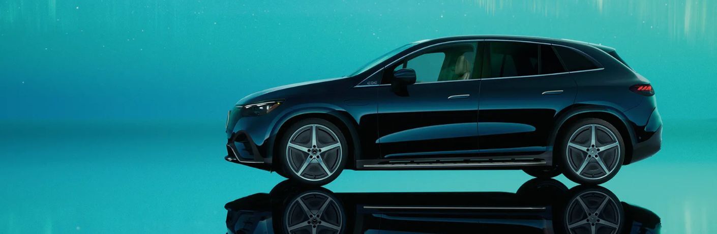 2026 Mercedes-Benz EQE SUV side view in a blue room