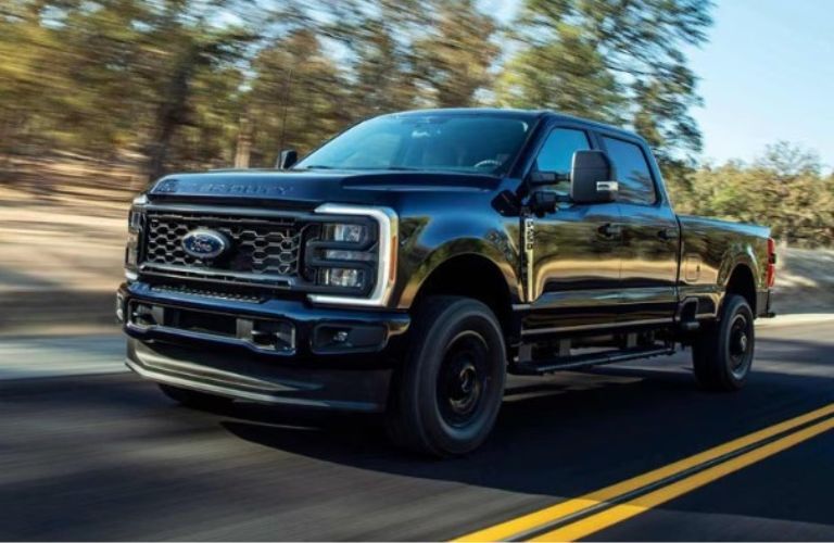 2025 Ford Super Duty F-250 XL front and side view on a road