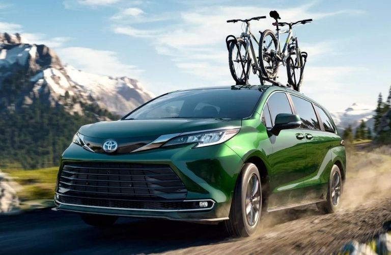 2022 Toyota Sienna front and side view with two bicycles on top