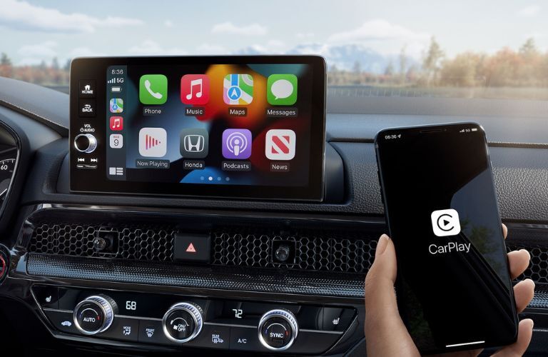 A person connecting Apple CarPlay in the 2024 Honda CR-V Hybrid