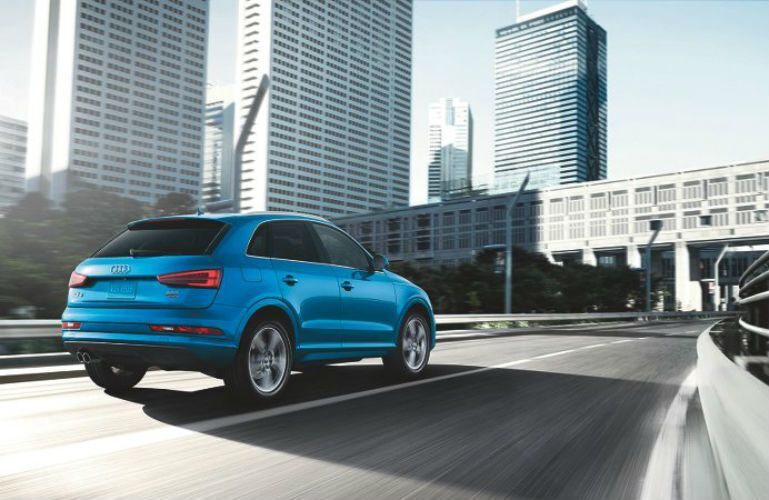 2017 Audi Q3 driving through a city