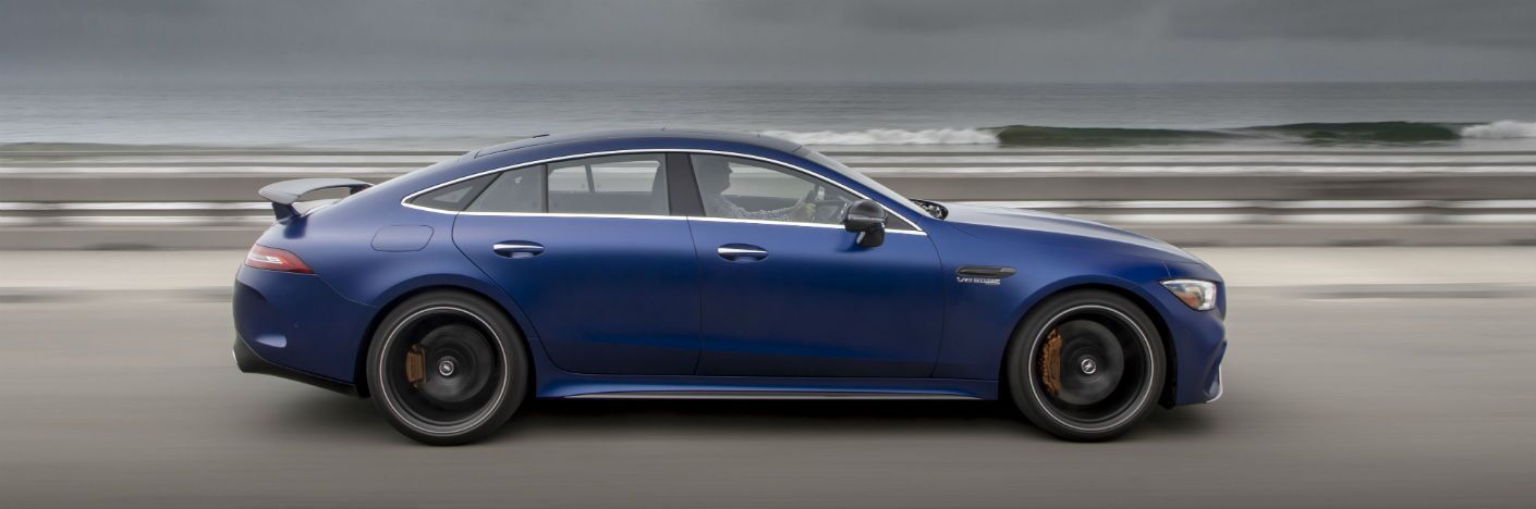 2020 MB AMG GT Coupe exterior passenger side profile going fast on oceanside highway