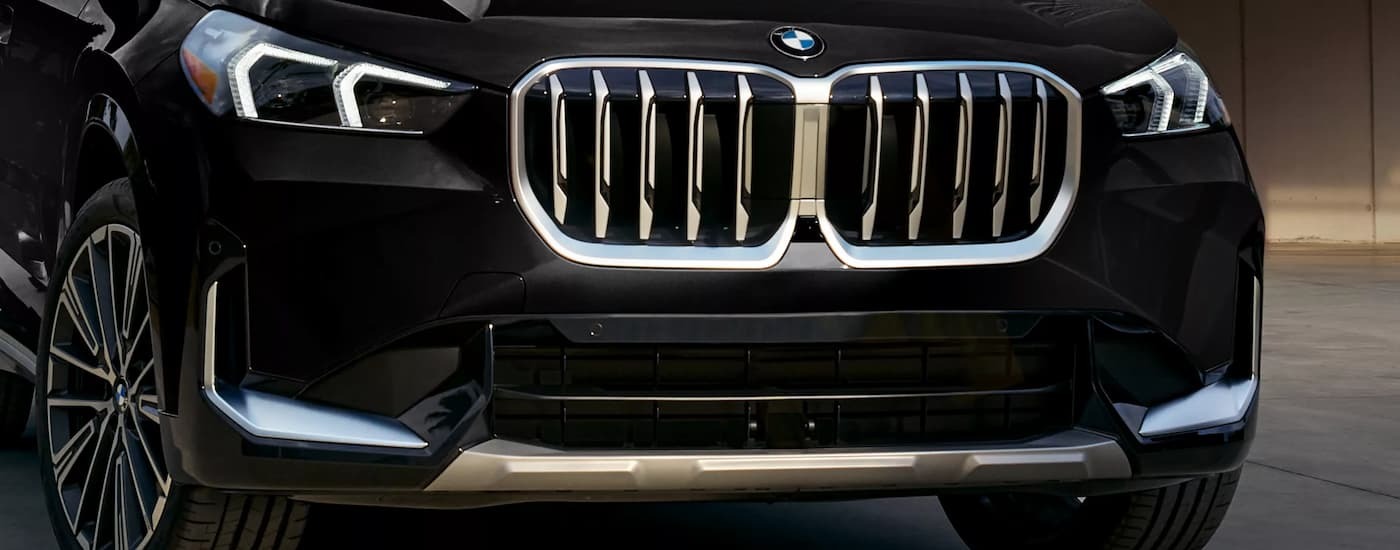 Black 2026 BMW X1 for sale parked at a car dealership