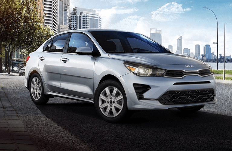 2023 Kia Rio in front of a building