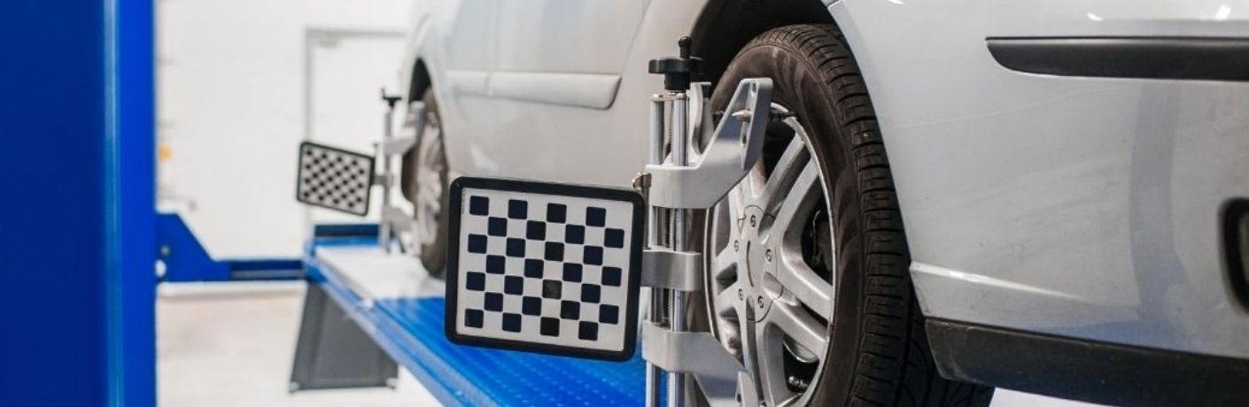 Tire alignment service at a service center