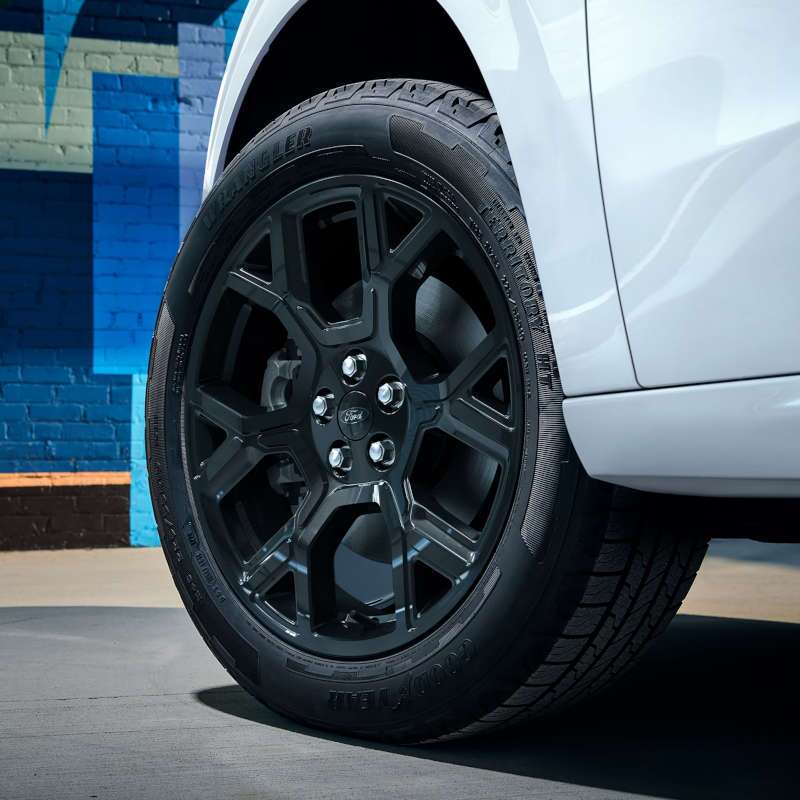 A detail view of the front wheel of the 2026 Ford Maverick