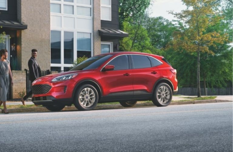 2023 Ford Escape red parked across the road