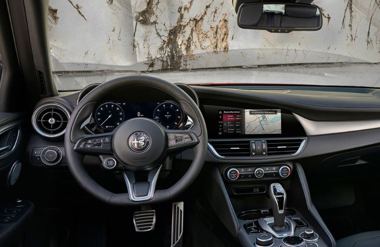 interior steering and dashboard of an Alfa Romeo car
