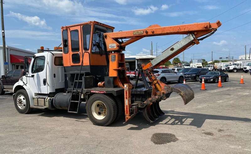 A used Petersen grapple truck from Dirt Cheap Truck Sales in Tampa, FL.