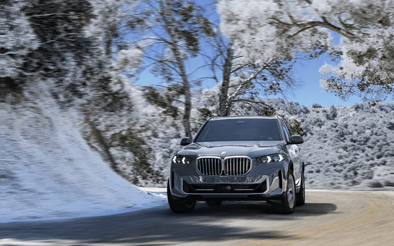 2025 BMW X5 sDrive40i driving in winter front-view