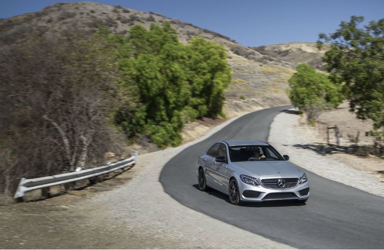 2015 Mercedes-Benz C400 4MATIC Sedan driving on desert road
