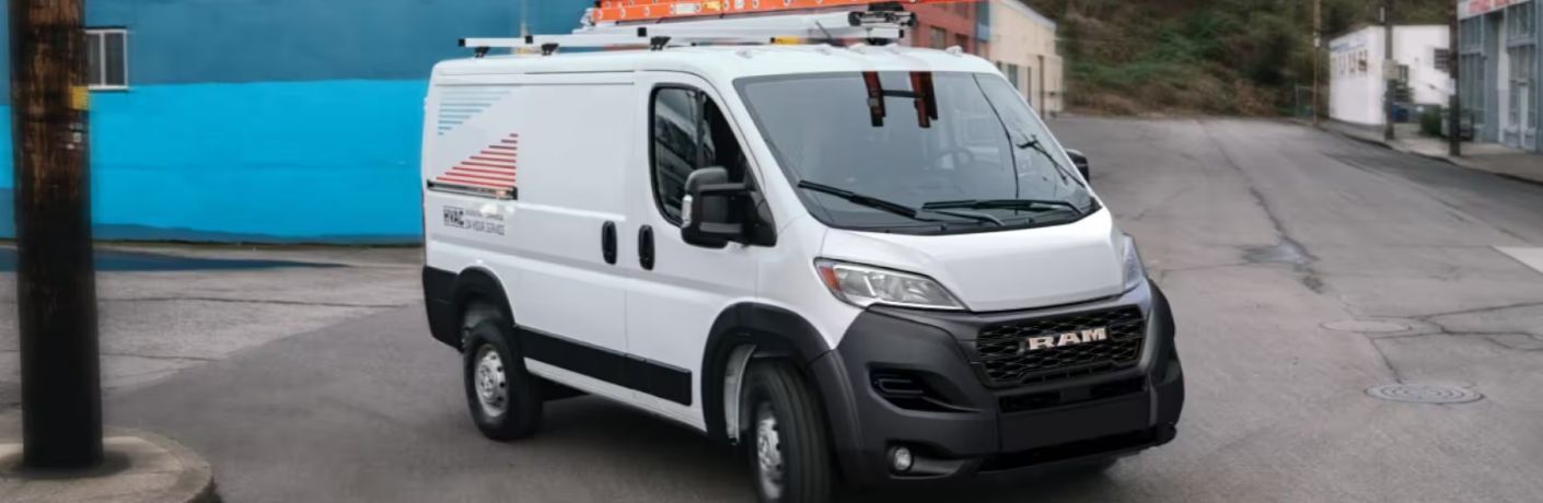 a white Ram ProMaster Cargo Van at a worksite