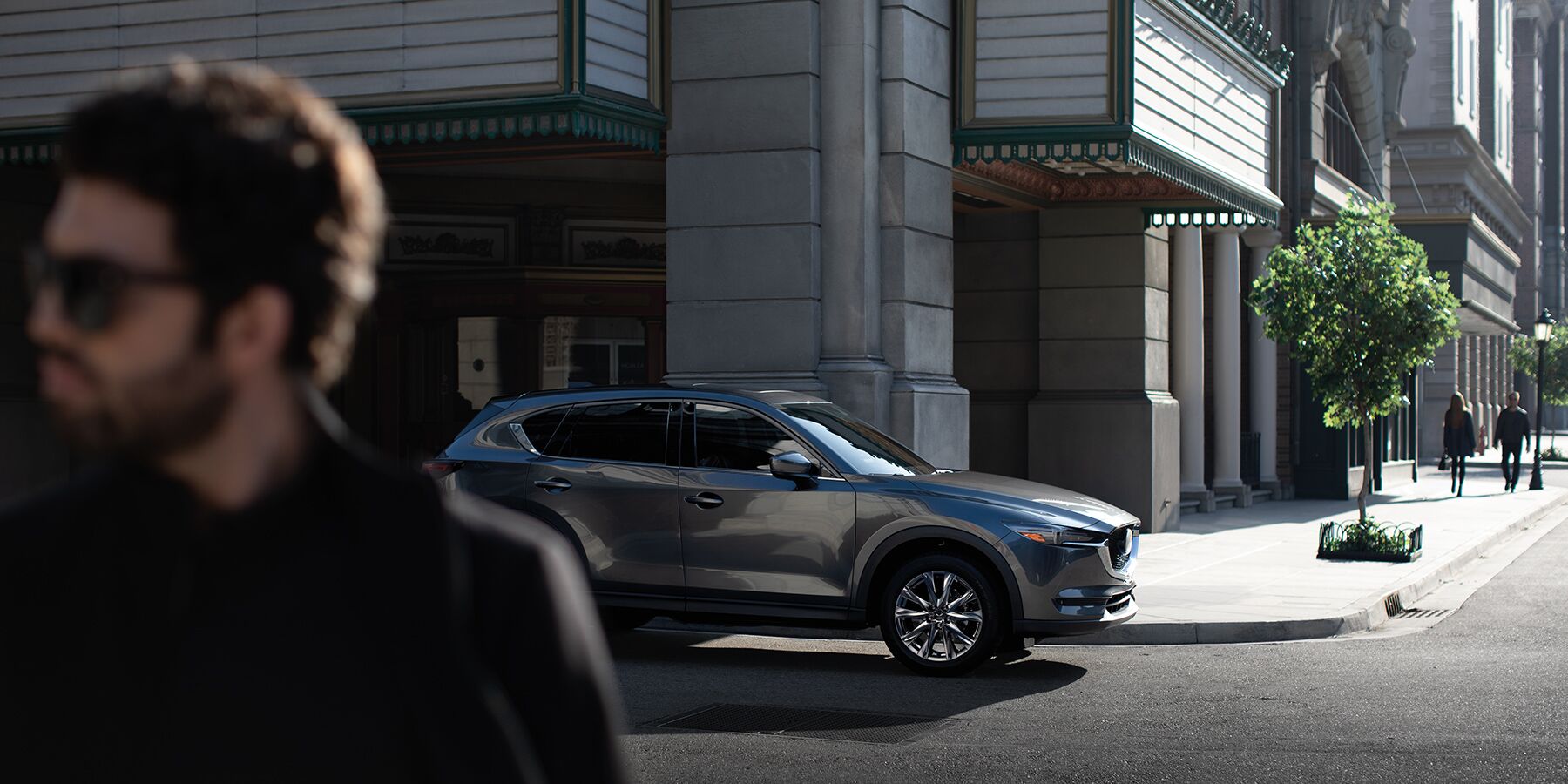 2020 Mazda CX-5 driving down a city street