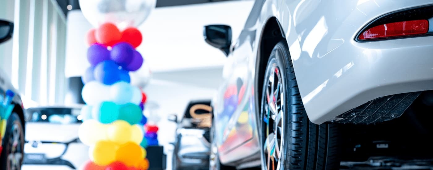 Interior of a car dealership with a balloon pillar.