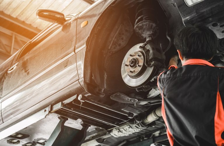 A mechanic working on a vehicle