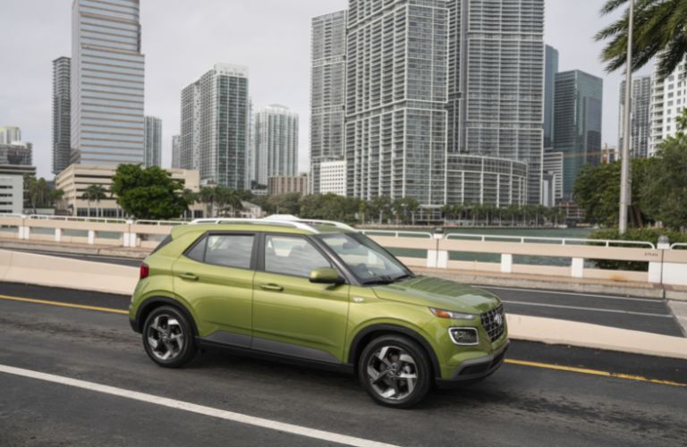 2023 Hyundai Venue Green driving on the road