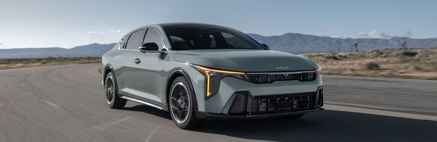 2025 Kia K4 driving on the road