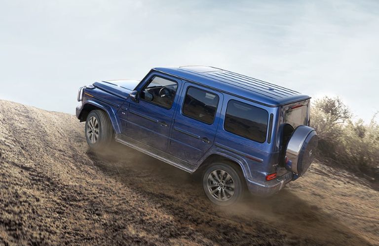Side view of the 2023 Mercedes-Benz G-Class driving off-road