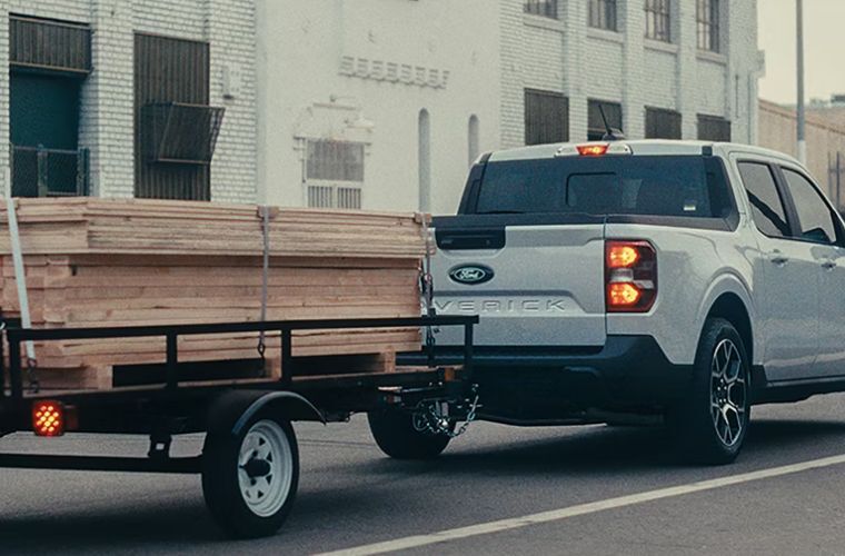 2026 Ford Maverick XLT towing wood