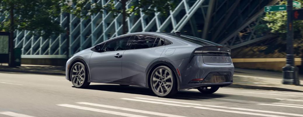 One grey color 2023 Toyota Prius Prime is running on the road.