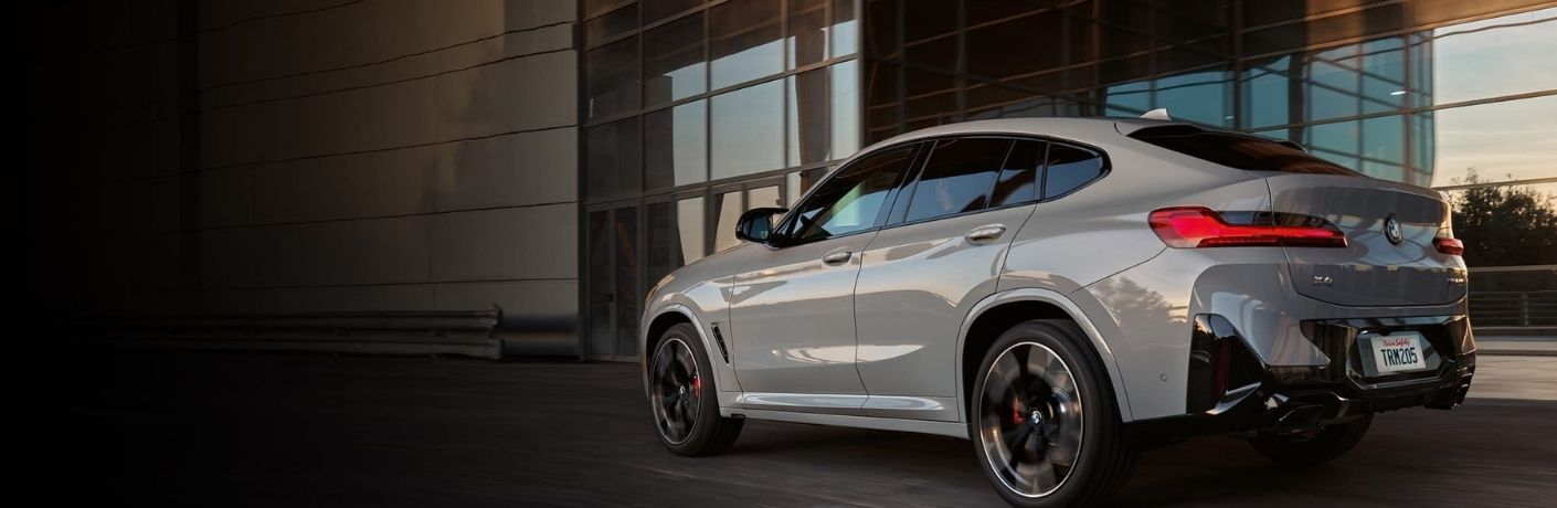 Back and side angle of a white BMW is shown