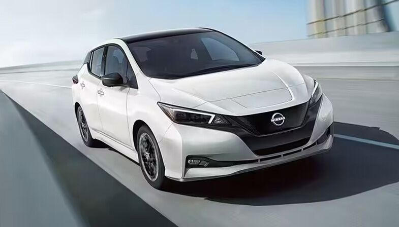 White Nissan EV on the road