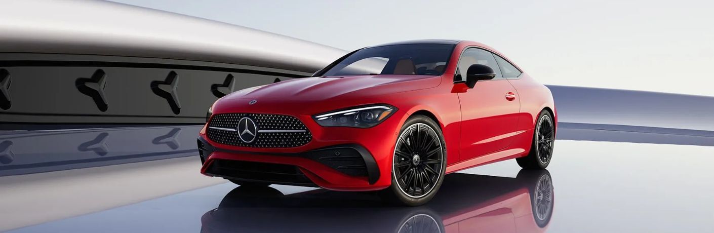 Front-quarter view of the 2026 Mercedes-Benz CLE 450 4MATIC® Coupe Red
