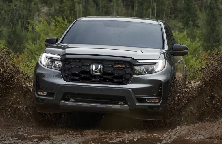 2024 Honda Ridgeline driving through mud