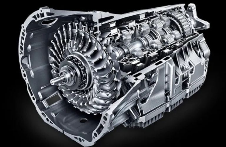 A close up picture of the drivetrain of a Mercedes-Benz car